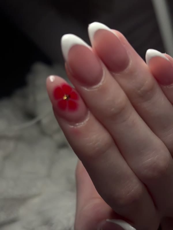 Almond French tips with a hand-painted red flower by Abi