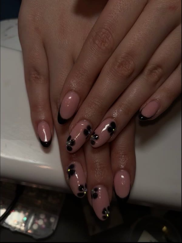 Michaela's French tips with black floral art by Abi